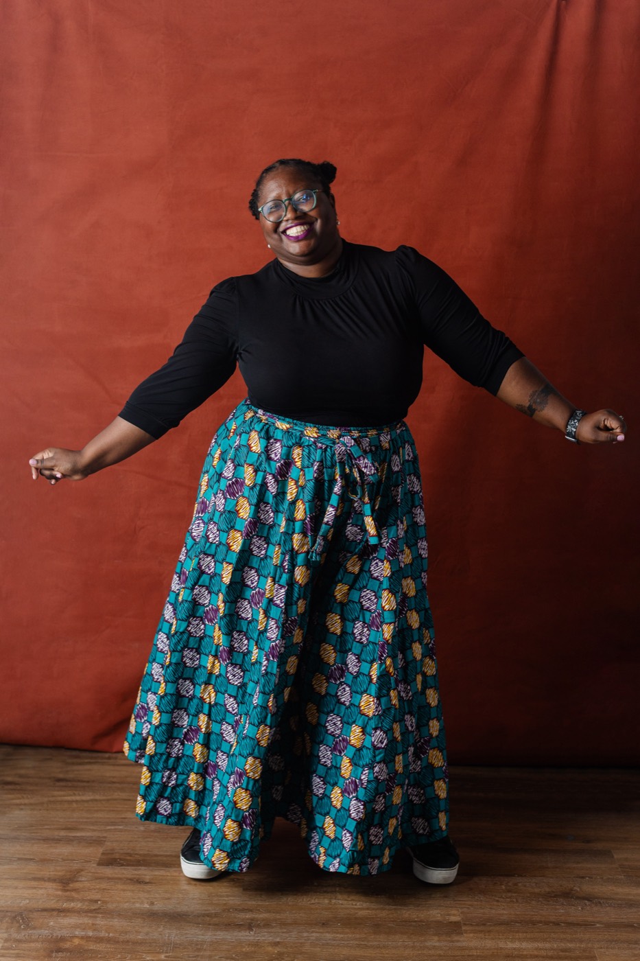 Alexis Appollonia Robinson with arms open