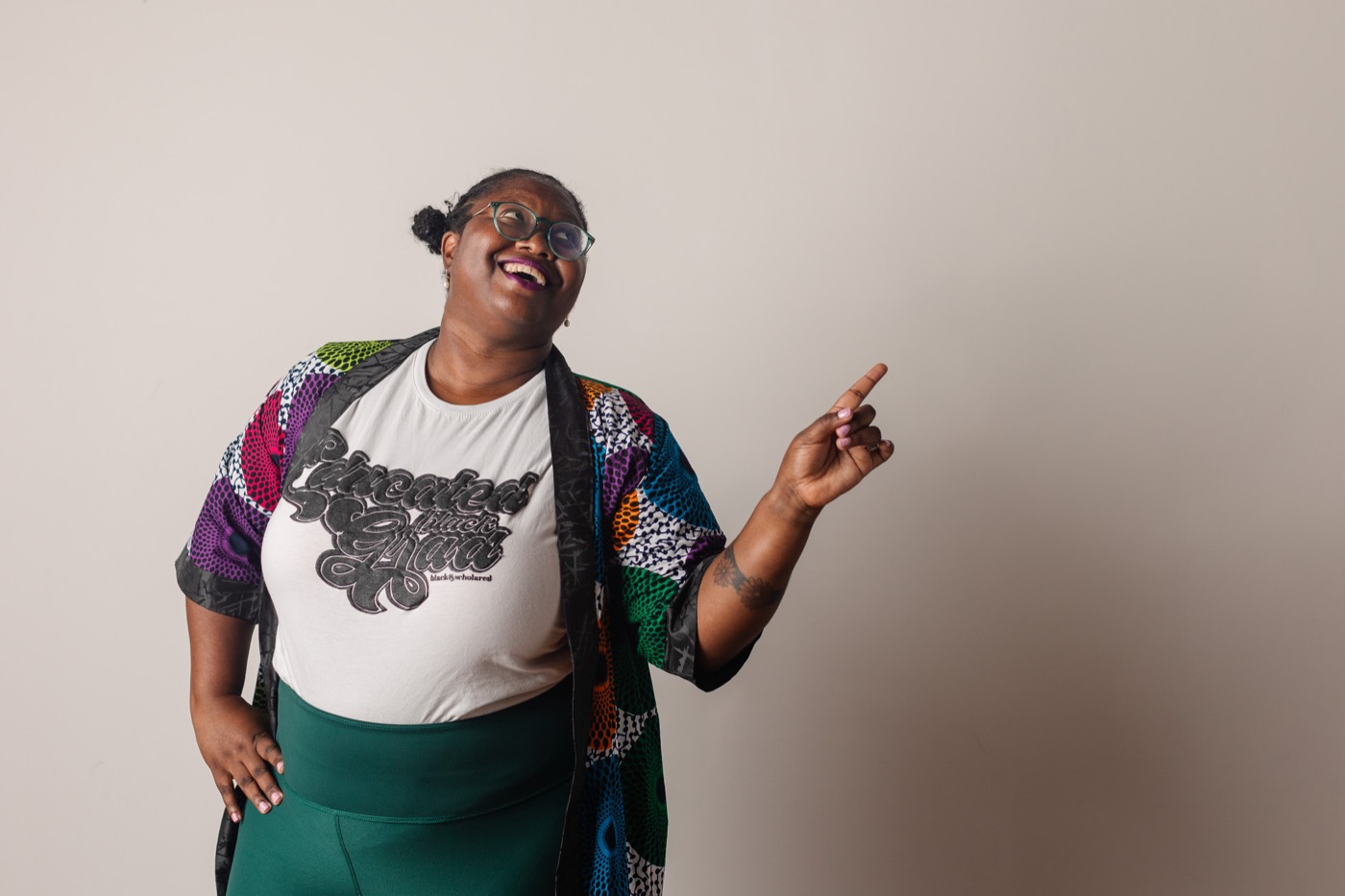 Alexis Appollonia Robinson smiling and pointing